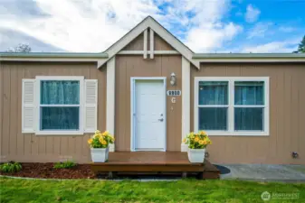 The front entry offers a warm, welcoming first impression with clean lines and classic charm.