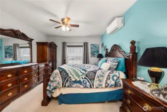 The primary bedroom offers plenty of space to unwind, with room for a full furniture set and a relaxed, comfortable feel.