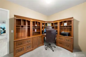 This third bedroom offers a flexible space for guests, work, or hobbies, with blackout honeycomb shades for comfort and privacy.