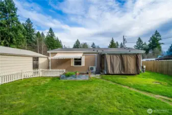 The spacious fenced backyard offers plenty of room to relax, garden, or enjoy the fresh PNW air in a private setting.