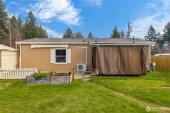 The backyard provides a private, open space with room to enjoy fresh air, gardening, or outdoor time at your own pace.