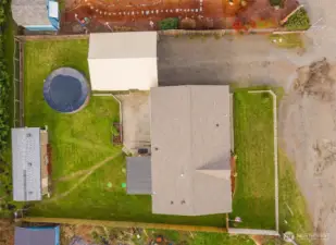 A bird’s-eye view ties the property together, highlighting the spacious lot, outdoor areas, and a NEW ROOF for added peace of mind.