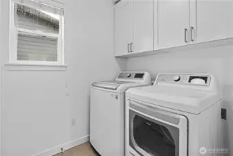 Laundry room with cabinets