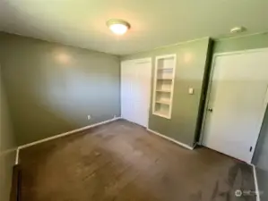 Second bedroom with built-in shelving