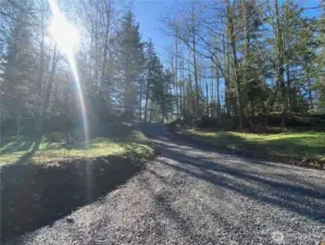 Newly installed 100' driveway. Utilities trenched in on either side of the driveway. Power and water meters installed.