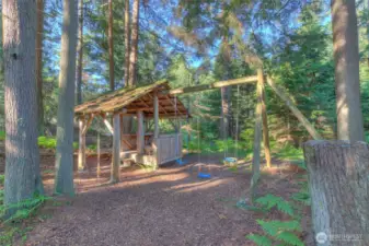 Play area in the woods adjacent to the lake.