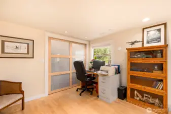 Spacious office filled with natural light and ample storage options