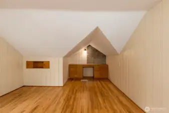 A roomy guest room featuring a built-in desk