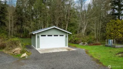 A garage or workshop that accommodates two cars
