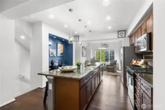 Enjoy the natural light from outside while sipping coffee at the large kitchen island.