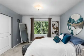 Primary suite overlooking the green space.
