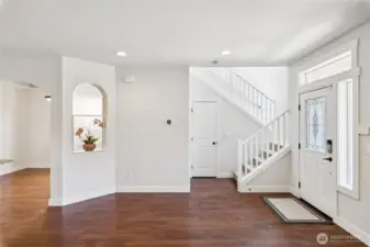 Entry with open stair railing