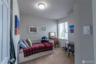 Bright and versatile spare bedroom offers endless possibilities—perfect as a home office, guest suite, or hobby room. Large window fills the space with natural light