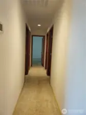 Hallway from the Livingroom area and looking down the hallway to the primary  suite