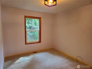 The den is as large as the second bedroom!  The perfect place for your home office/ craft room or ?? and has a bit more useable space as it has no closet.  This room takes in territorial views