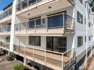 Expansive deck featuring an attached storage unit, perfect for gatherings or quiet relaxation.