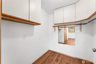 Primary bedroom walk in closet.