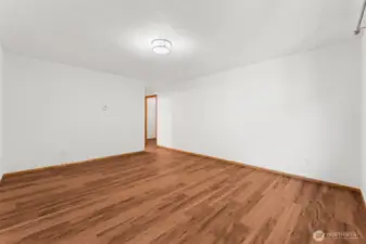 Spacious primary bedroom with private bath and walk-in closet.