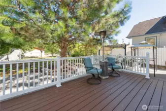 Your own outdoor oasis—gazebo, awning, fruit trees, and year-round blooms.