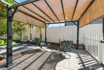 Multiple outdoor seating areas perfect for summer gatherings.