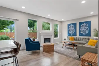 This light-filled living area offers a fireplace, perfect for quiet evenings.