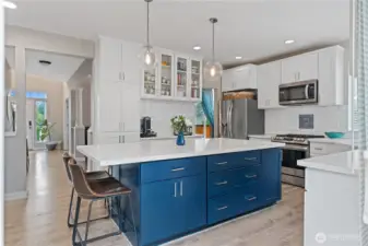 The kitchen flows effortlessly into the heart of the home—perfect for everything from casual weeknight dinners to lively weekend celebrations.
