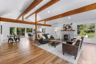 Luxury vinyl plank flooring and radiant floor heating thoughout all of the upper level.  Minisplits and pellet stove provide other sources of heat.  AC also in place.