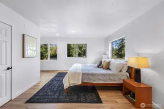 Spacious primary bedroom.  Door to the left is towards a primary closet.