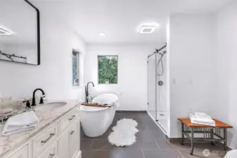 Two windows out to the forest from primary bath.