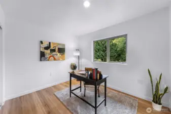 Third upper bedroom is staged here as a simple office - looks out towards the back of the home.