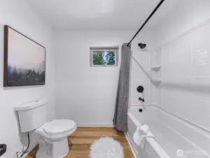 Second guest bathroom has full tub and shower.