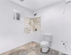 3/4 bath is ready to bring your design plans.  Shower straight ahead, sink with cabinetry to the right.