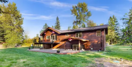 A chicken coop is seen to the right. Septic and external sump pump lids to the right.