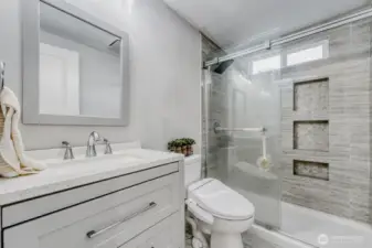 Updated bathroom with modern finishes.