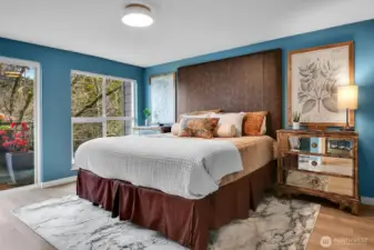 Spacious primary bedroom with its own private balcony.