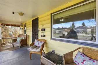Enjoy the spacious covered porch with seating area.