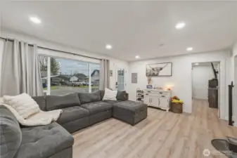 Large picture window looks out to street and brings in lots of light.  Primary bedroom is through door to right.