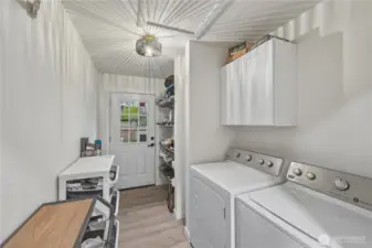 Utility/mud room with door to back deck. Great extra storage.