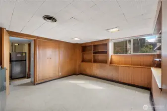 Basement bedroom with curtain for the door.