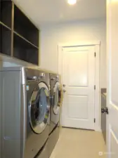 THE LAUNDRY ROOM HAS PLENTY OF STORAGE SPACE PLUS A SOAKING SINK IN THE CORNER!