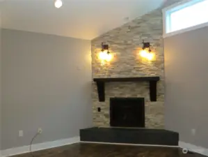 LIVING AREA HAS BEAUTIFUL STONE BUILT-IN PROPANE FIREPLACE WITH MANTLE AND HEARTH!