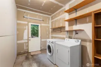 Laundry room has been added to the garage.  Finish or remove the wall to have full garage access.