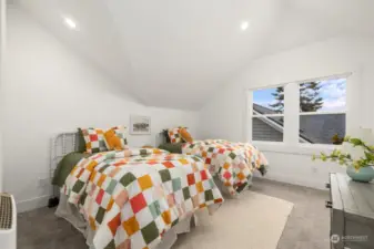 One of three bedrooms on top floor.  Nice vaulted ceilings. Very spacious bedroom.