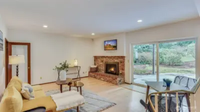 Expansive great room with an open layout just off the kitchen, cozy gas fireplace and easy access to the back patio.