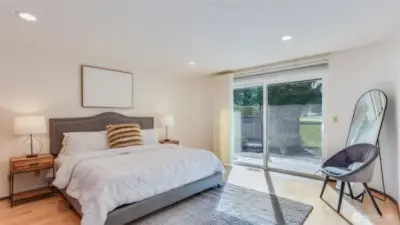 Retreat to this oversized primary bedroom with direct access leading to the back patio and offering views of the golf course.