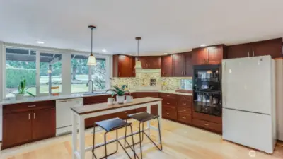 Well-appointed and open kitchen with space for island or smaller dining space —perfect for casual meals and morning coffee.