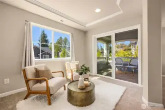 The sitting area in the primary could also be a home office or workout area.