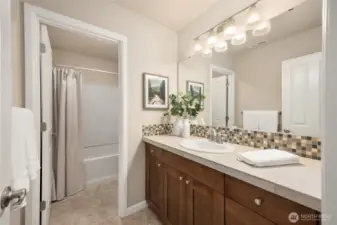 The main hallway bathroom upstairs with a tub and shower combo.