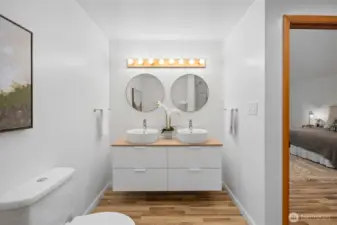 Primary ensuite refreshed bath with double vanity.