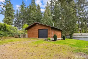 Newer metal roof on garage, all insulated, 240v, tons of outlets, and a new wood stove installed in 2021.
